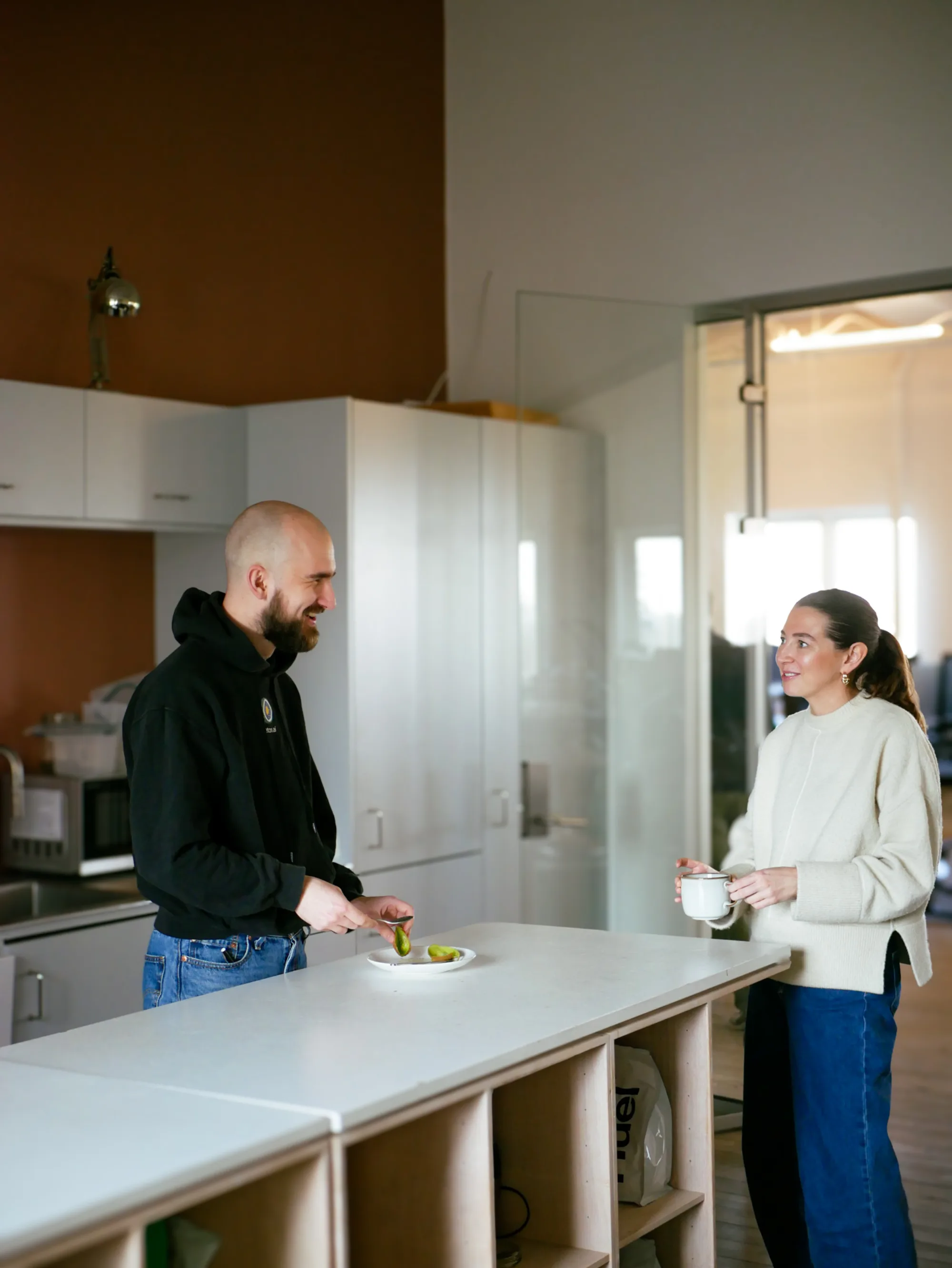 Teton teammates talking in the office kitchen