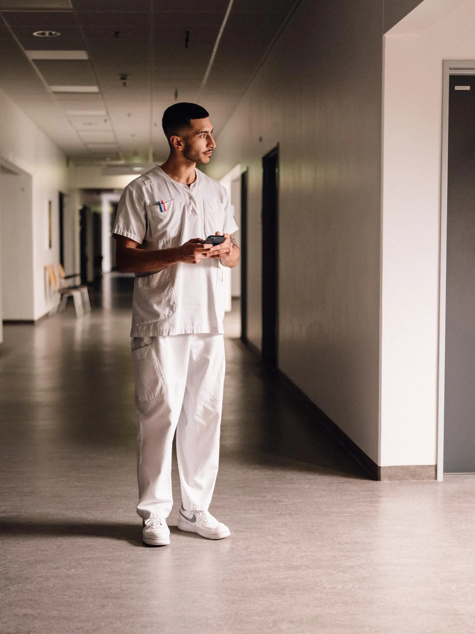 Male nurse in hospital corridor