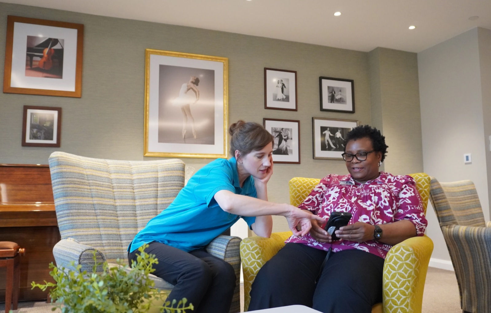 Nightingale Hammerson care staff reviewing Teton insights together in a communal lounge